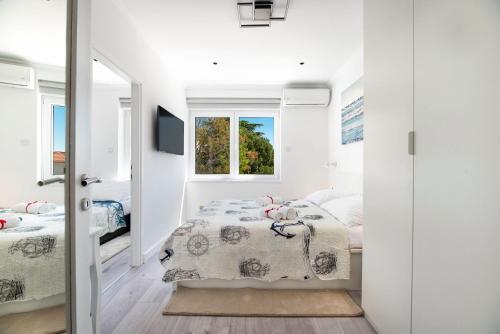 Posteľ alebo postele v izbe v ubytovaní Apartment Ella