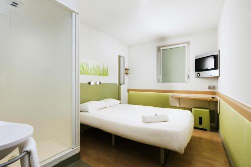 Кровать или кровати в номере ibis budget Hotel Edinburgh Park