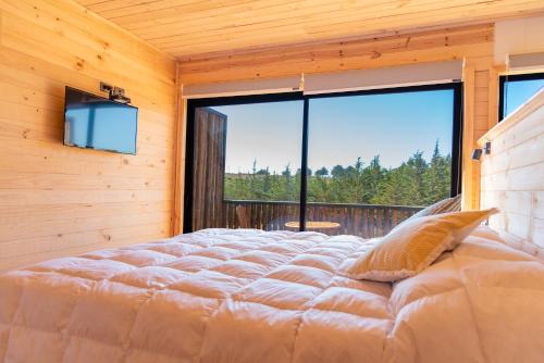 Giường trong phòng chung tại 360 Lodge Pichilemu