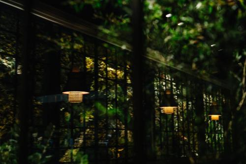 a group of lights hanging from a fence at Mercure Kyoto Station in Kyoto
