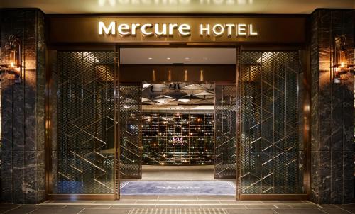 a store entrance to amerience hotel with a sign on it at Mercure Kyoto Station in Kyoto