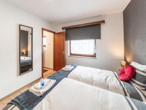 เตียงในห้องที่ The Inseparable beautiful apartment for 7 adults in Malmedy