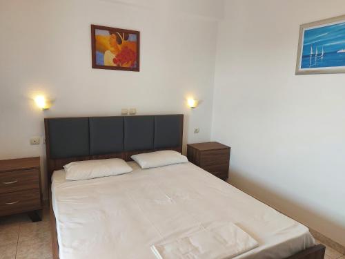 Ένα ή περισσότερα κρεβάτια σε δωμάτιο στο Apocalypsis Studios-Apartments