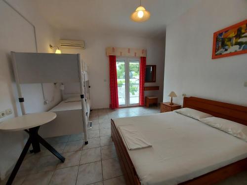 Ένα ή περισσότερα κρεβάτια σε δωμάτιο στο Apocalypsis Studios-Apartments