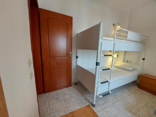 Ένα ή περισσότερα κρεβάτια σε δωμάτιο στο Apocalypsis Studios-Apartments