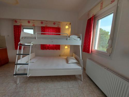 Posteľ alebo postele v izbe v ubytovaní Apocalypsis Studios-Apartments