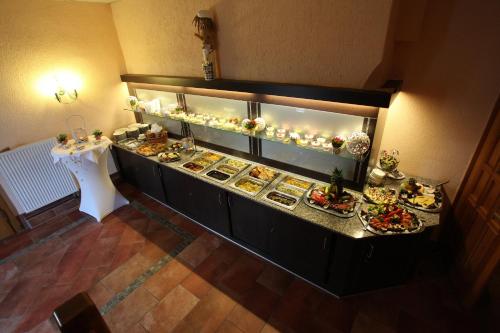 an overhead view of a buffet with plates of food at Goldene Krone in Belgershain