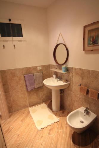 a bathroom with a sink and a mirror at VERNAZZA CENTRALE in Vernazza