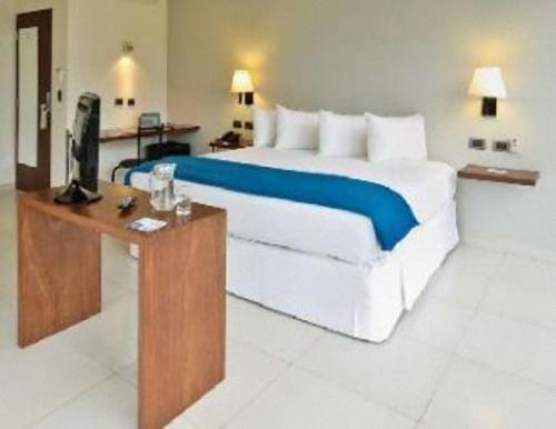 Letto o letti in una camera di Hotel LP Santa Cruz Centro