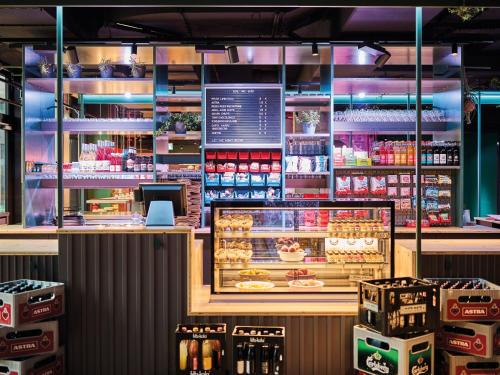 a grocery store with a display of food at Urban Nature St Peter-Ording in Sankt Peter-Ording