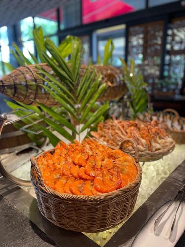 two baskets of food sitting on a table at Anantara Vacation Club Mai Khao Phuket in Mai Khao Beach