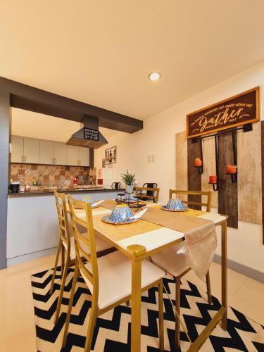 a kitchen and dining room with a table and chairs at Bayview Country Inn El Nido in El Nido