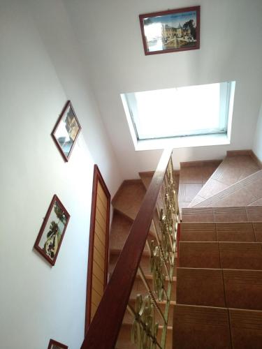 a staircase with a skylight in a house at Manor Villa in Hévíz