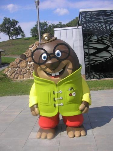 a large stuffed animal wearing glasses and a jacket at APARTMA LINDAU in Lendava
