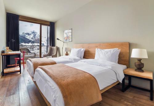 Voodi või voodid majutusasutuse Rooms Hotel Kazbegi toas