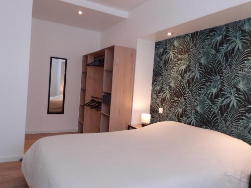 Postel nebo postele na pokoji v ubytování KALEE APPARTEMENT T2