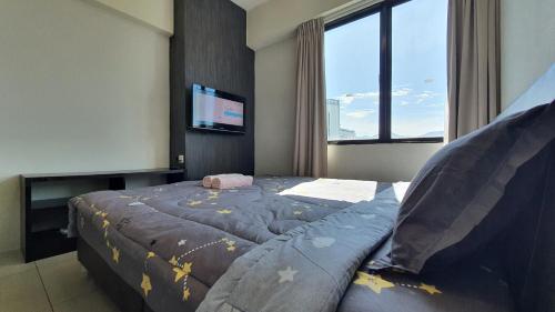 Voodi või voodid majutusasutuse Kinta River Front Suites Ipoh by Beestay toas