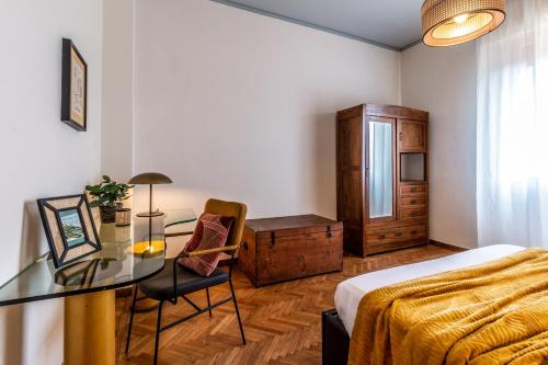 A bed or beds in a room at Dimora Vintage San Tommaso by Wonderful Italy