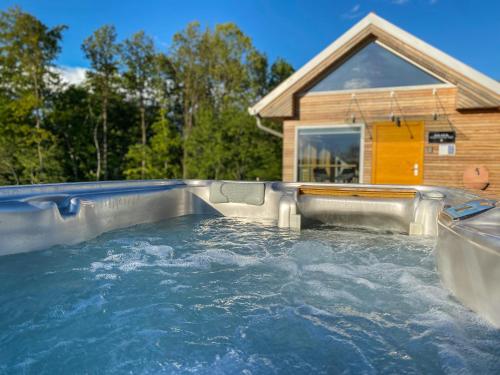 a large plunge pool in front of a house at Wellness hiška Robida in Ljutomer