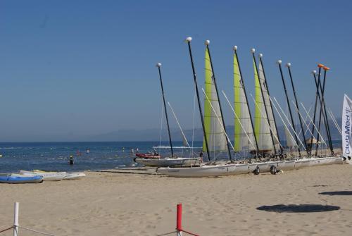 a group of sailboats lined up on the beach at Appartement Miradorgolf in Cabo Negro