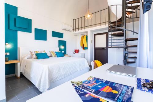 a room with two beds and a ladder at Hotel & Spa Relais Freedom Club in Massa Lubrense