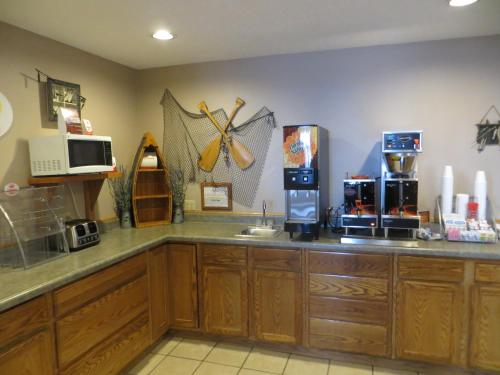 a kitchen with a counter with a coffee maker at Super 8 by Wyndham Spearfish in Spearfish