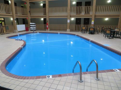 a large blue swimming pool in a hotel room at Super 8 by Wyndham Spearfish in Spearfish