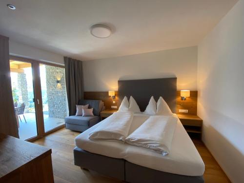 מיטה או מיטות בחדר ב-Appartement Josef am Untersüßgut