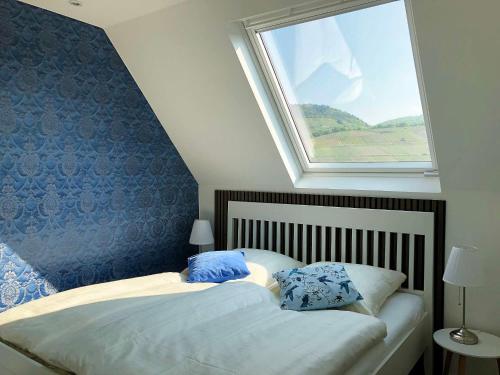 a bedroom with a large window and two beds at Ferienhaus Kövenig in Kövenig