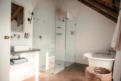 a bathroom with a glass shower and a sink at Penhill Farm West Grange in Nuy