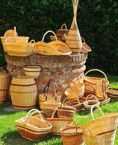 a group of baskets sitting in the grass at CASCINA DOMINA in Gassino Torinese