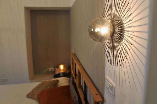a mirror on the wall of a room at CASA ARCO BIANCO in Giovinazzo