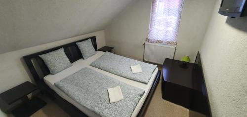 Postel nebo postele na pokoji v ubytování Apartman House