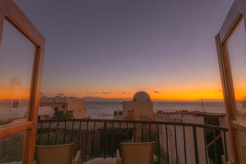 a view of a sunset from a balcony at The Bedouin Moon in Dahab