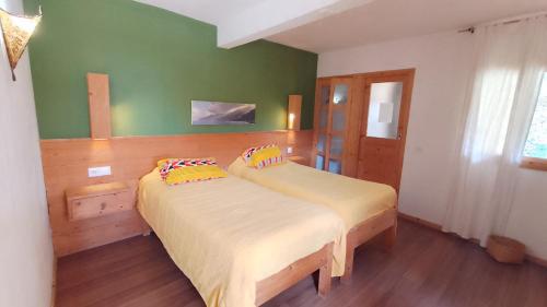 מיטה או מיטות בחדר ב-Casa Cavoquinho