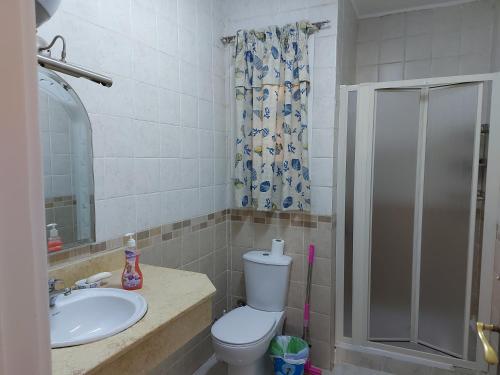 a bathroom with a toilet and a sink and a shower at Marina Wadi Degla Villa Duplex 4 Bedrooms in Ain Sokhna