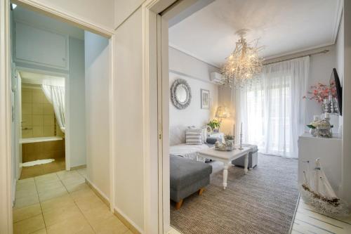 a living room with a couch and a table at Luxury Apartment Zeas Piraeus in Piraeus