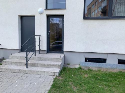 a door to a building with stairs in front of it at K76 - Very Nice 2-bedrooms Apartment -2 big beds-1 single bed in Tartu