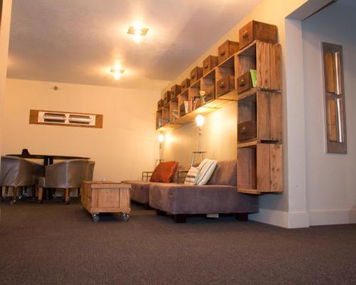 a living room with a couch and a table at Adrift Hotel in Long Beach