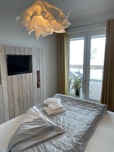 Un pat sau paturi într-o cameră la "Mehr Meer geht nicht"