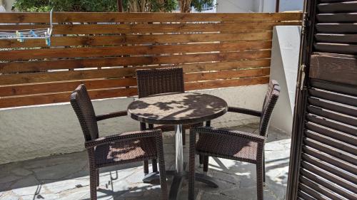 a table and two chairs on a patio at Pension Irene in Sougia
