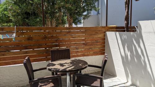 a table and two chairs on a patio at Pension Irene in Sougia