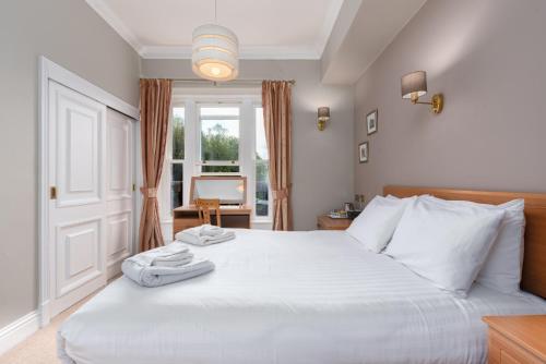 Cama o camas de una habitación en Windermere Manor Hotel