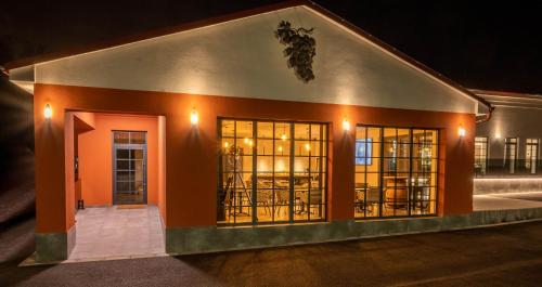 a building with windows at night at Veltlin Bed & Wine in Valtice