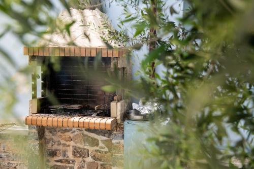 a bird nesting in a brick bird house at Sarakinas Residences in Myrtos