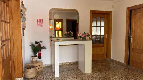 a bathroom with a sink and a mirror at Villa Mis 5 Amores con piscina in Benidorm