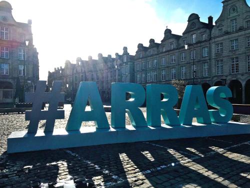 a large sign in front of a large building at Casa Nostra - Arrière Gare in Arras