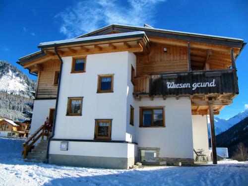 a building with a sign that reads western grind at Aparthotels Berwang / Haus Wiesengrund in Berwang
