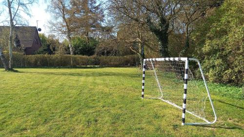a soccer goal in the middle of a field at Klintholm B & B Bistro in Borre