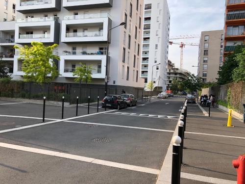 an empty street in a city with buildings at Appartements de 2 ou 3 chambres à 40 minutes de Paris in Evry-Courcouronnes